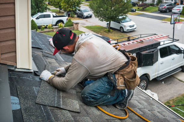 Professional Roof Replacement technician working in Belding, MI